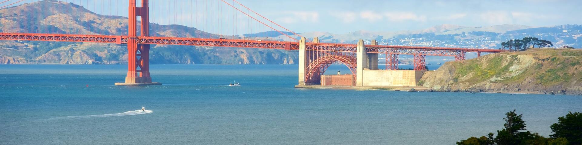 Coastal Trail featuring a bridge and a river or creek