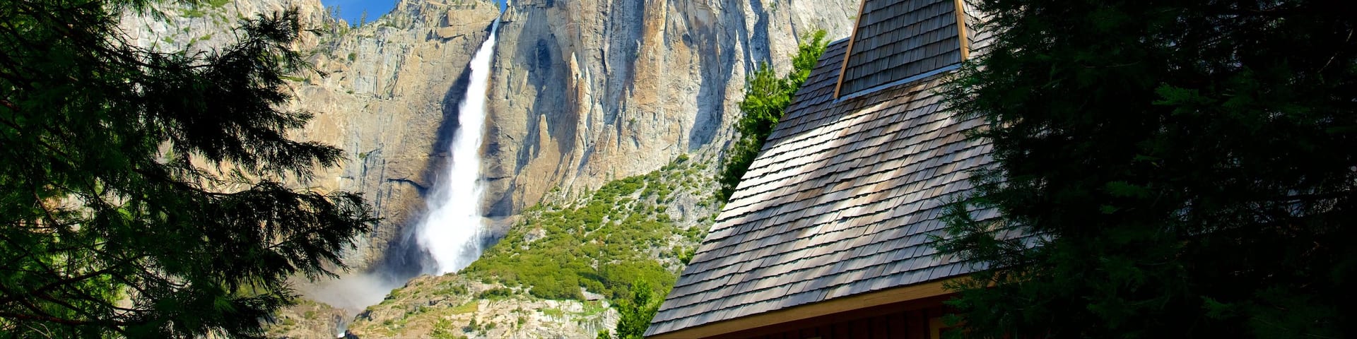 Yosemite Valley Chapel showing a cascade and heritage elements