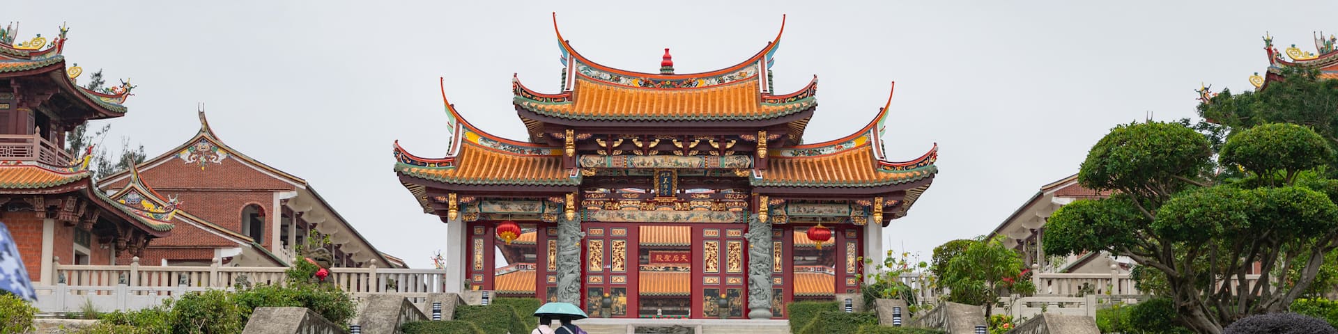 A-Ma Cultural Village featuring heritage elements and a garden as well as a small group of people