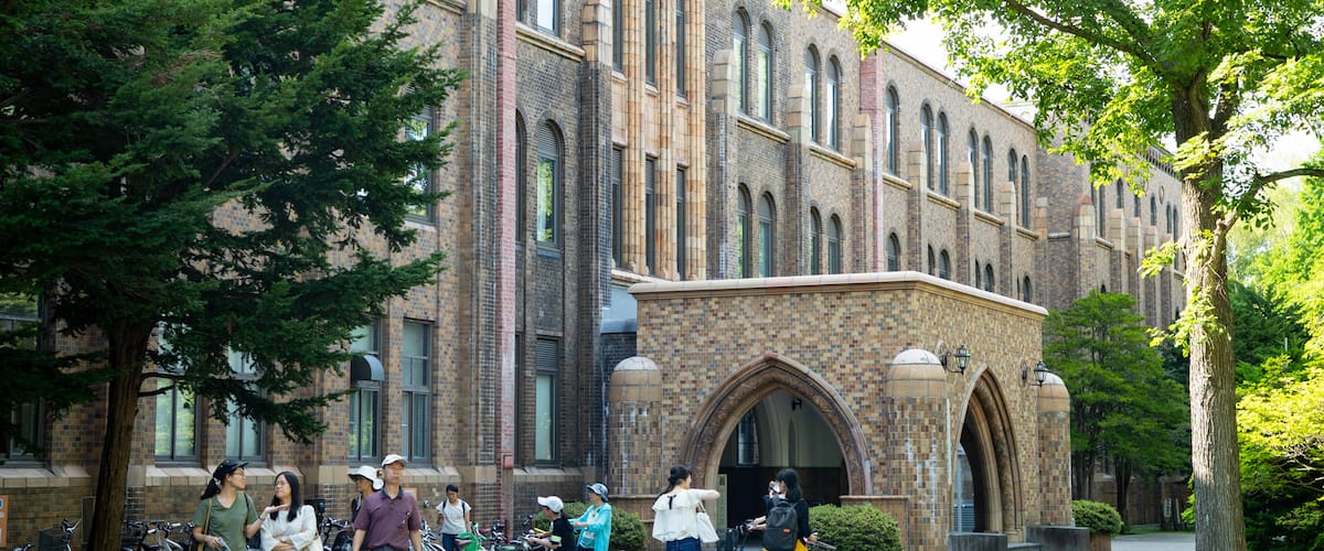 Hokkaido University featuring street scenes and heritage elements as well as a small group of people