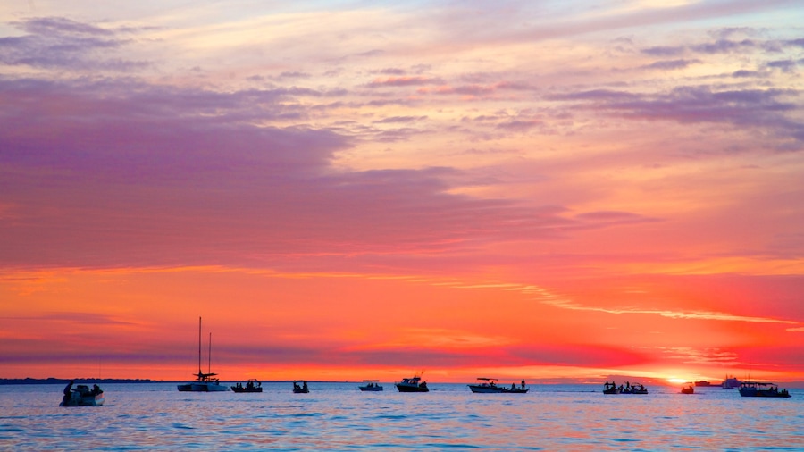 Mindil Beach which includes general coastal views, a sunset and landscape views