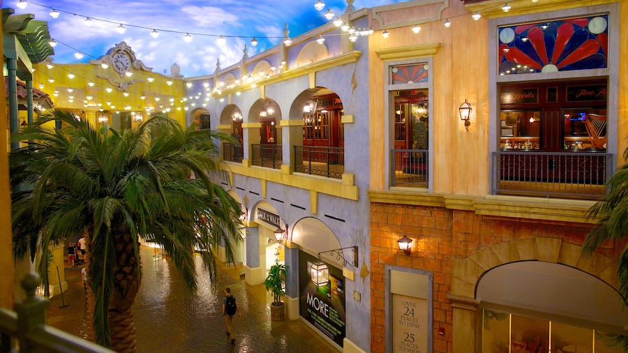 Quarter at Tropicana showing a city, night scenes and tropical scenes