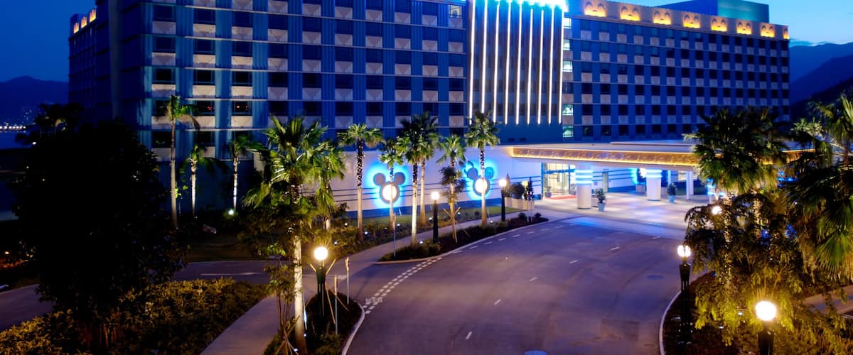 Hong Kong Disneyland which includes night scenes, a luxury hotel or resort and a square or plaza