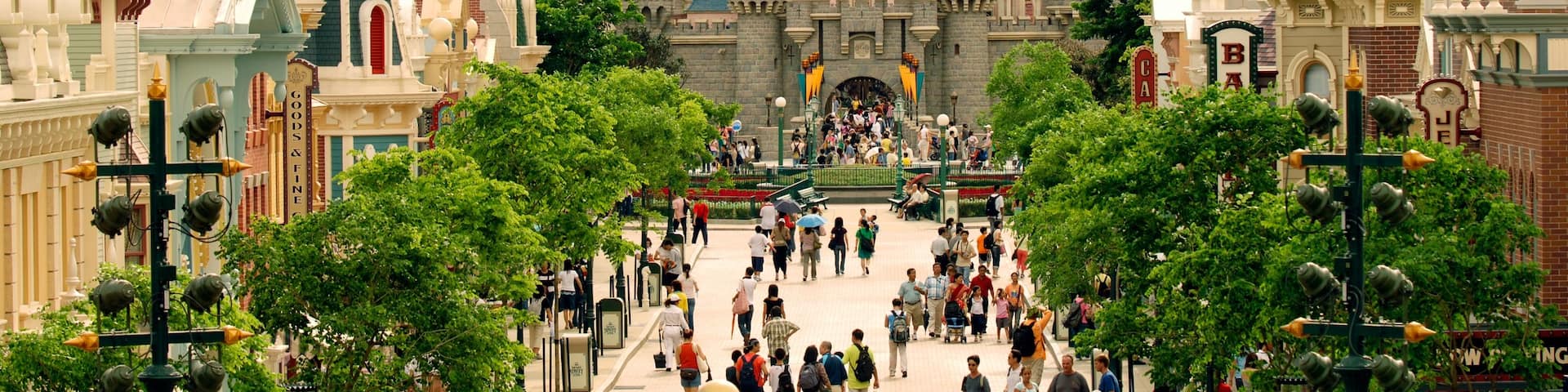 Hong Kong Disneyland® Resort featuring rides as well as a large group of people
