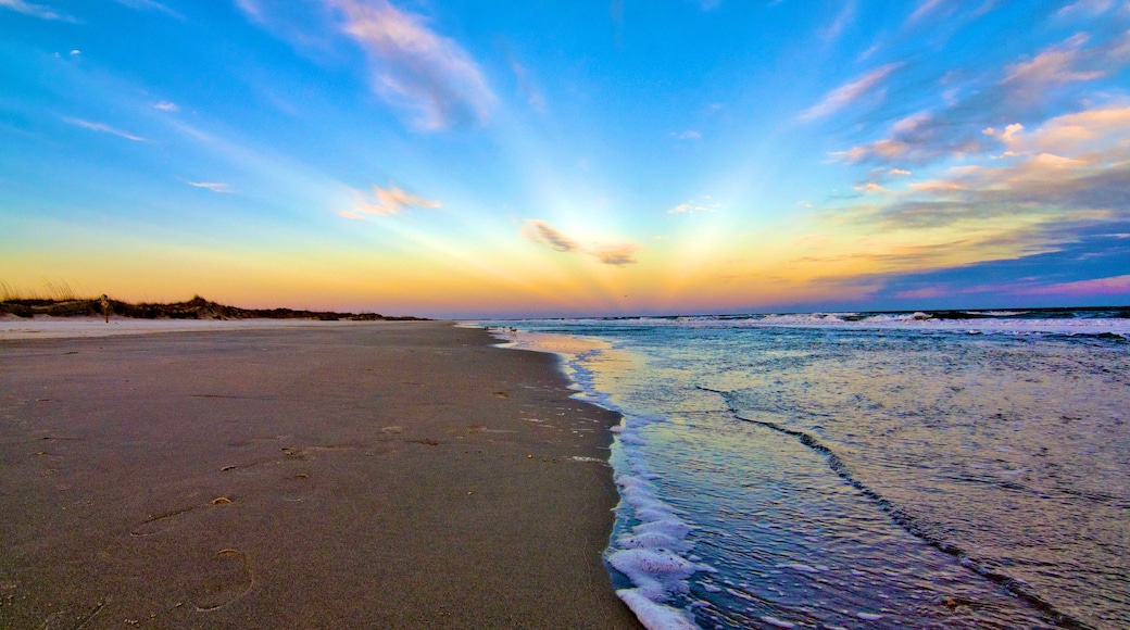 Huntington Beach State Park which includes a sunset and a beach