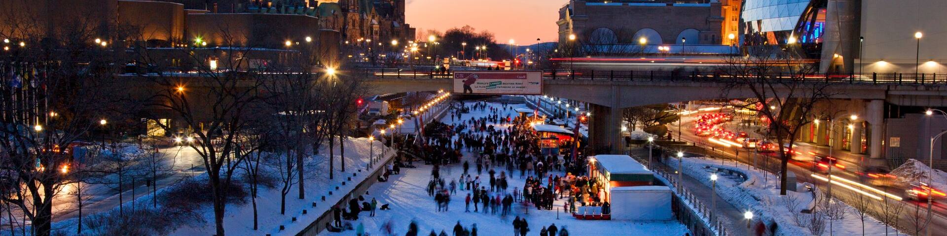 Rideau Canal featuring a city, a sunset and snow