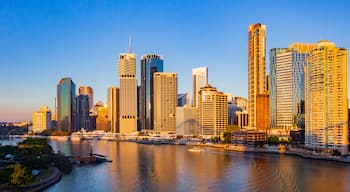 Brisbane Central Business District which includes a river or creek, a sunset and a city