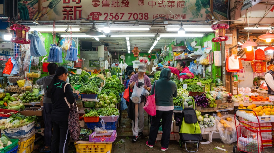 Shek O featuring food and markets as well as a small group of people