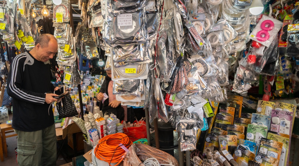 Apliu Street Market showing markets as well as an individual male