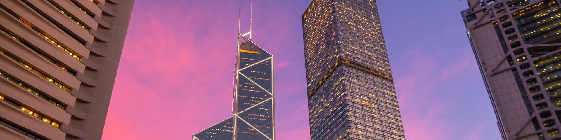 Central showing a skyscraper, a city and a sunset