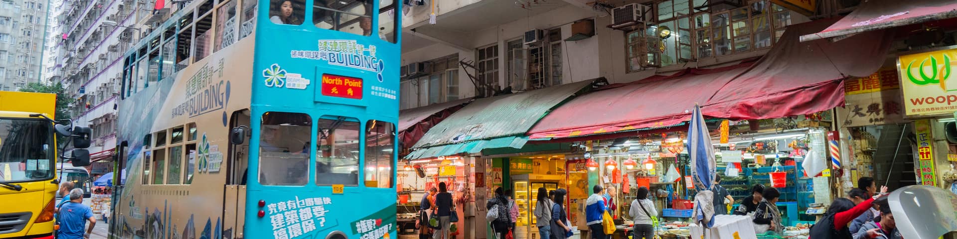 Chun Yeung Street Market showing a city, street scenes and railway items