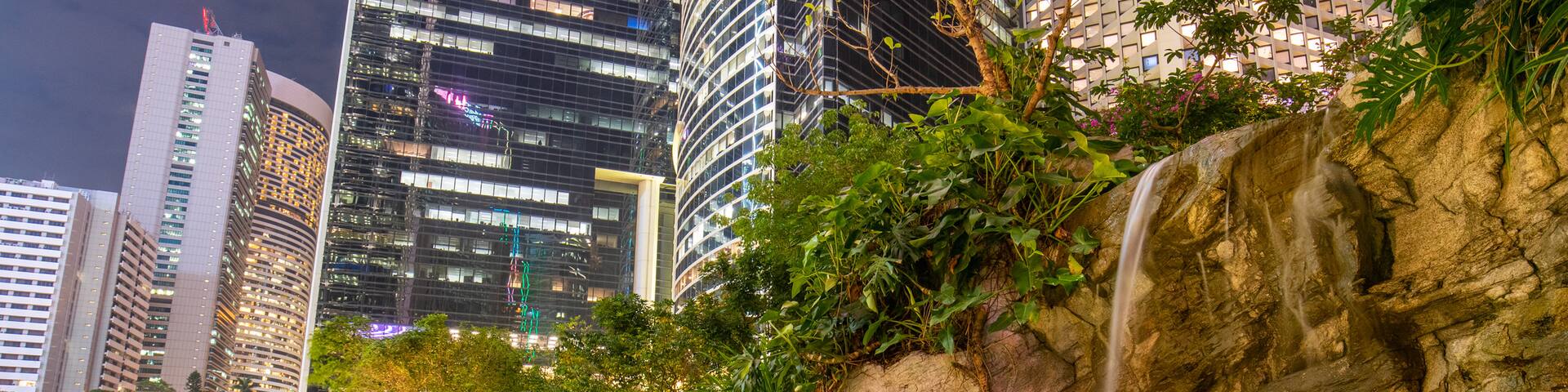 Cheung Kong Park which includes a city, night scenes and a park