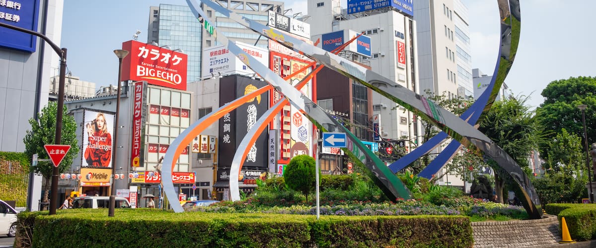 Ota featuring outdoor art and a city