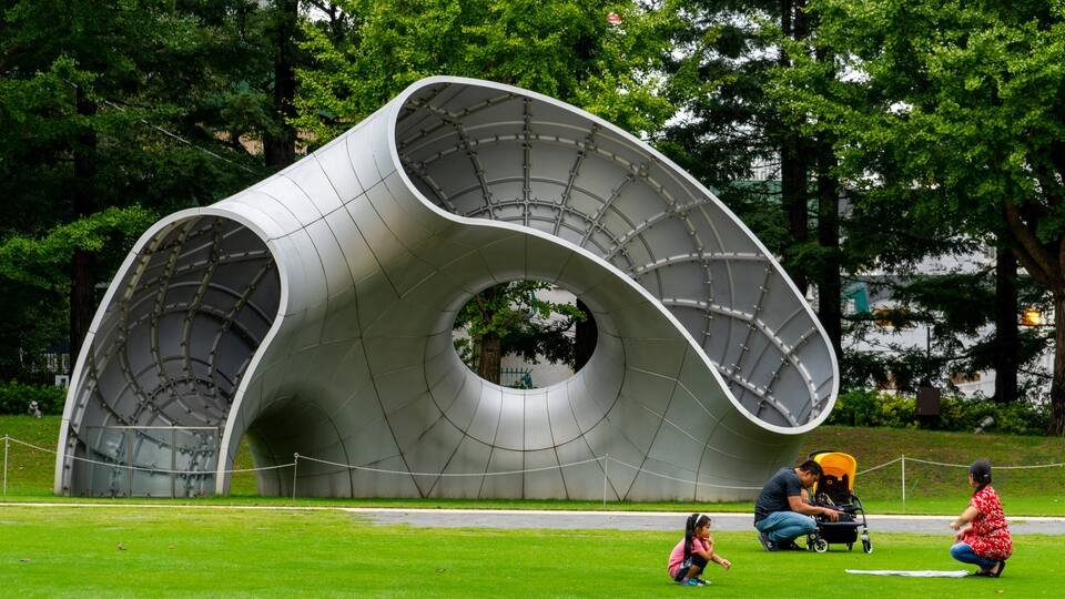 Tokyo Midtown which includes outdoor art and a garden as well as a family