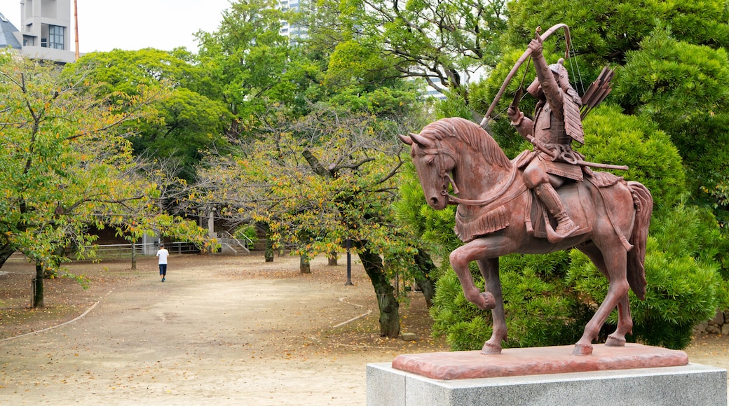 Chiba Castle featuring a garden and a statue or sculpture