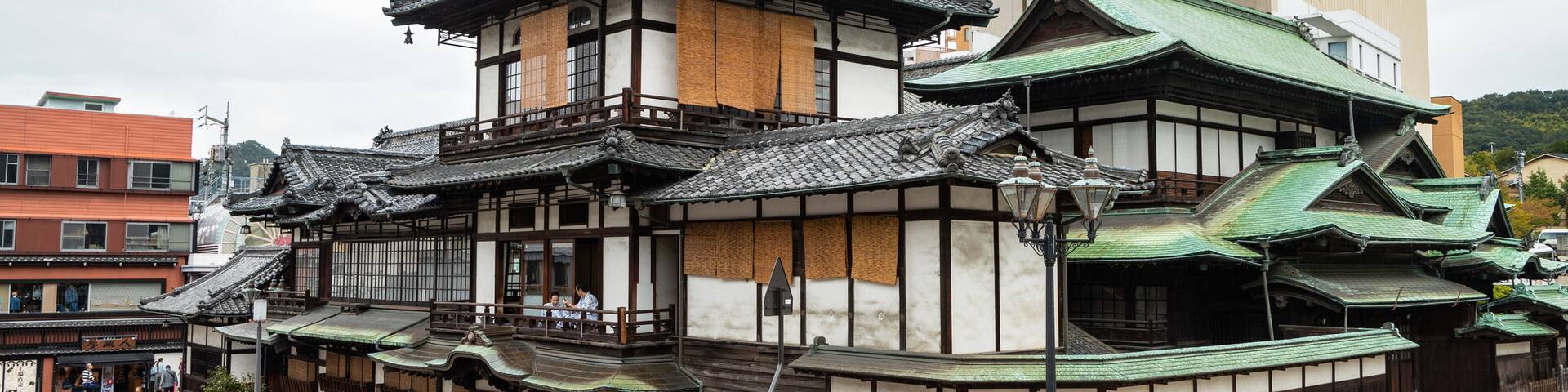 Dogo Onsen showing heritage elements and a city
