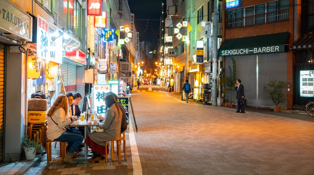 Kanda showing night scenes, street scenes and outdoor eating