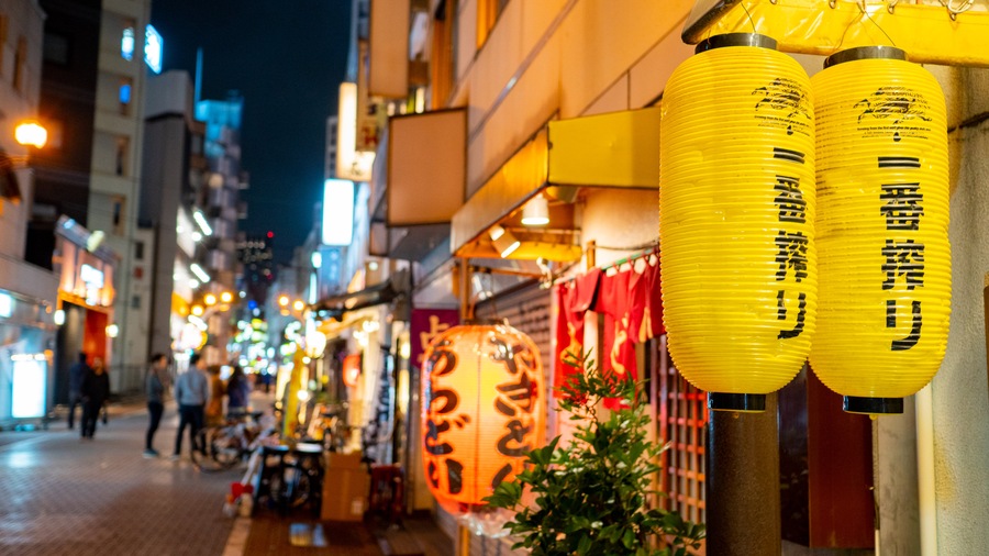Kanda featuring signage and night scenes