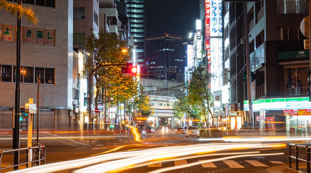 Kanda showing a city, night scenes and street scenes