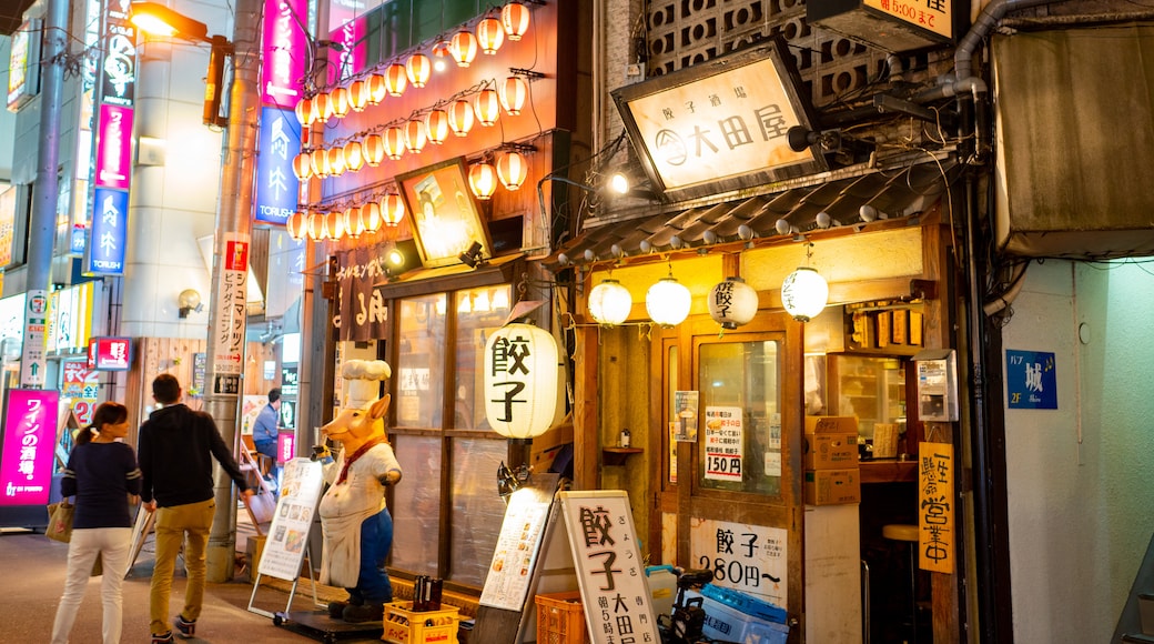 Kanda which includes street scenes, signage and night scenes