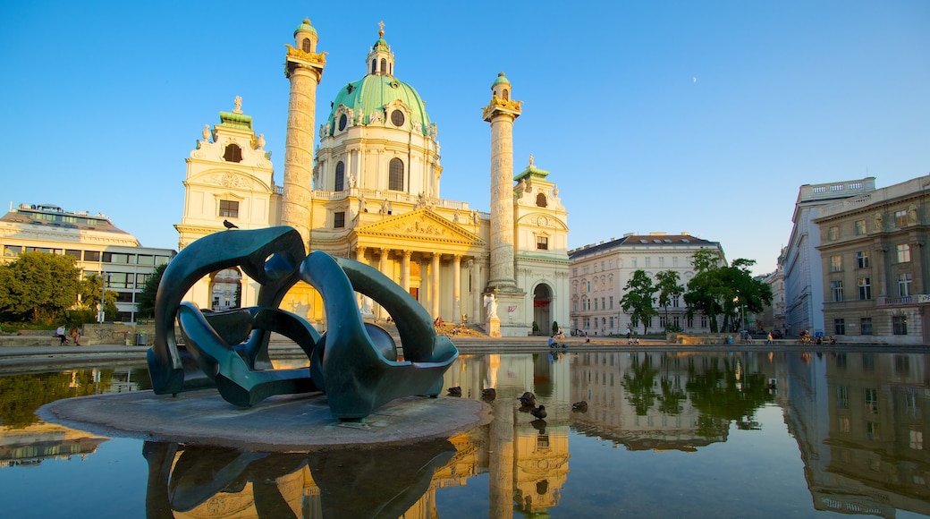 St. Charle\'s Church showing heritage architecture, a pond and religious elements