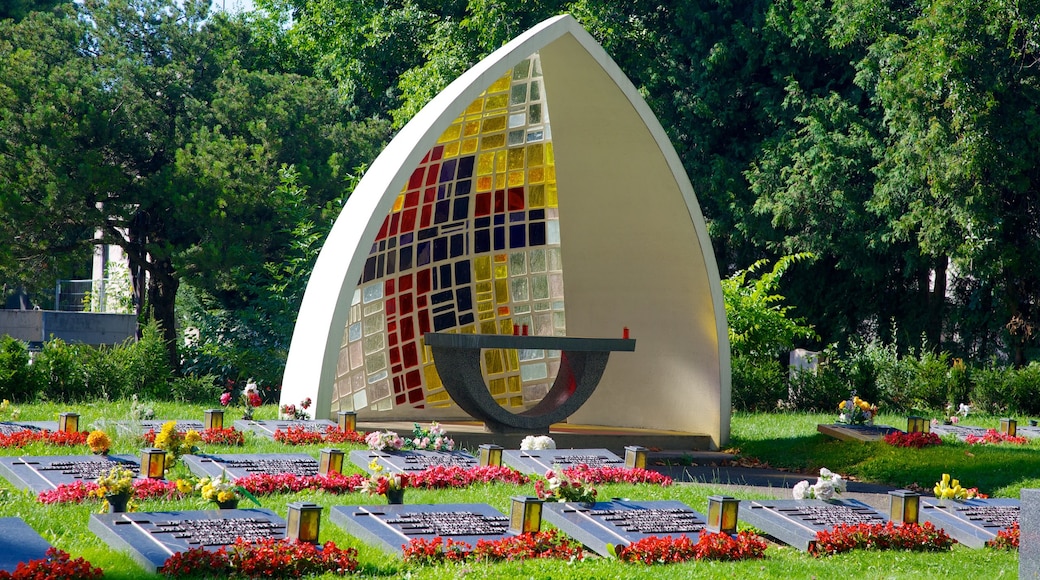 Central Cemetery showing religious elements, a park and flowers