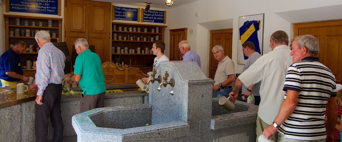 Augustiner Brewery which includes a bar, drinks or beverages and interior views
