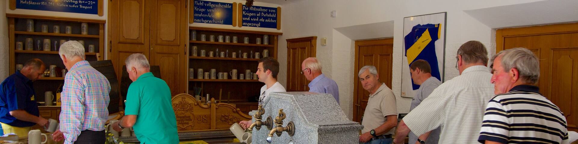 Augustiner Brewery which includes a bar, drinks or beverages and interior views