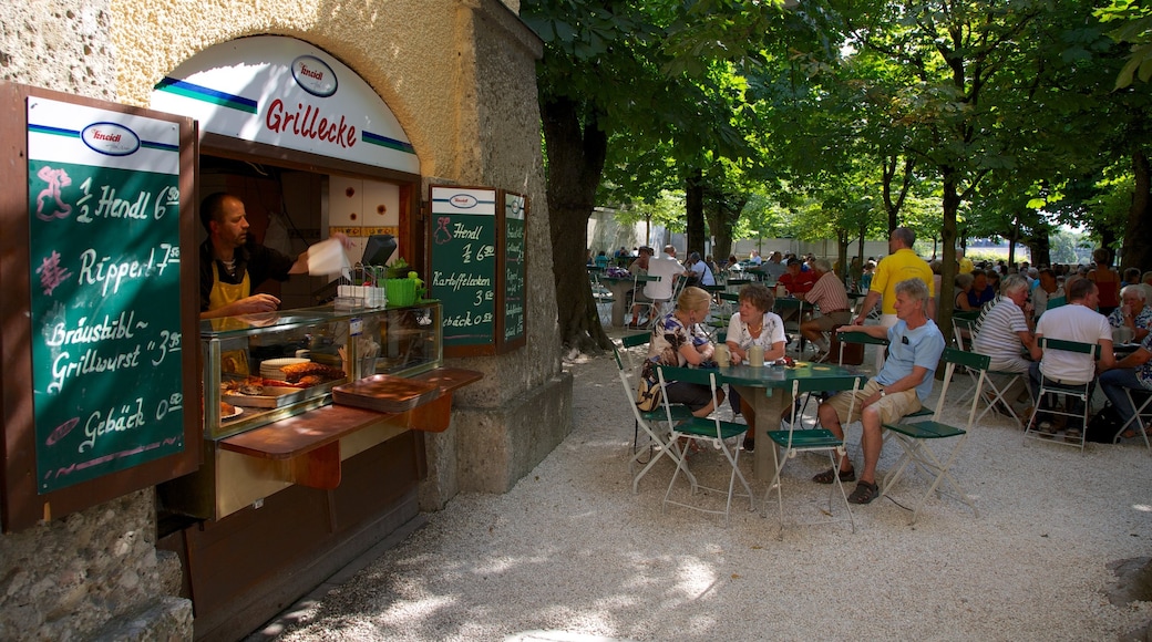 Augustiner Brewery showing cafe scenes and shopping as well as a large group of people