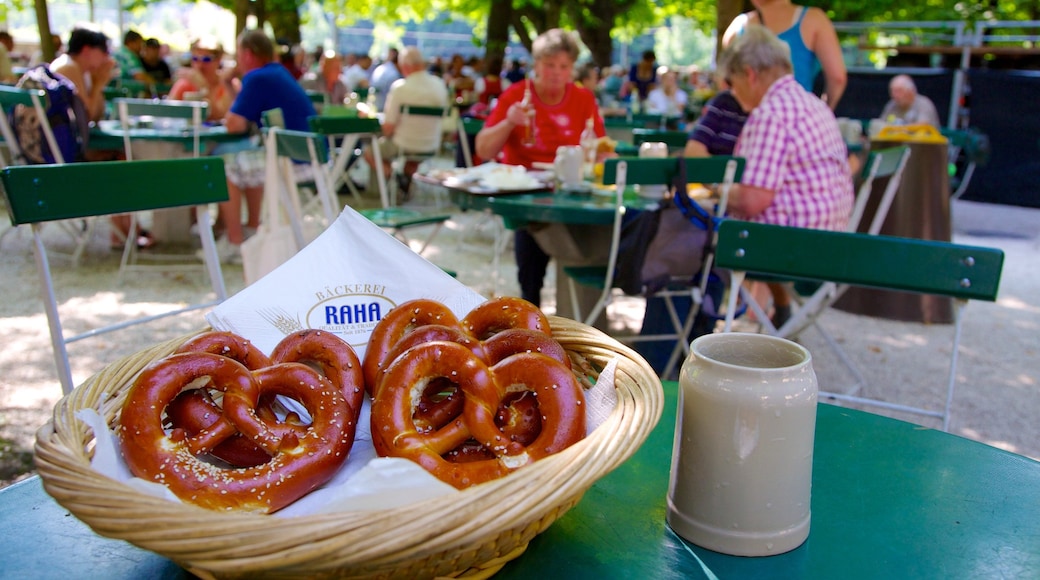 Augustiner Brewery featuring outdoor eating and food as well as a large group of people