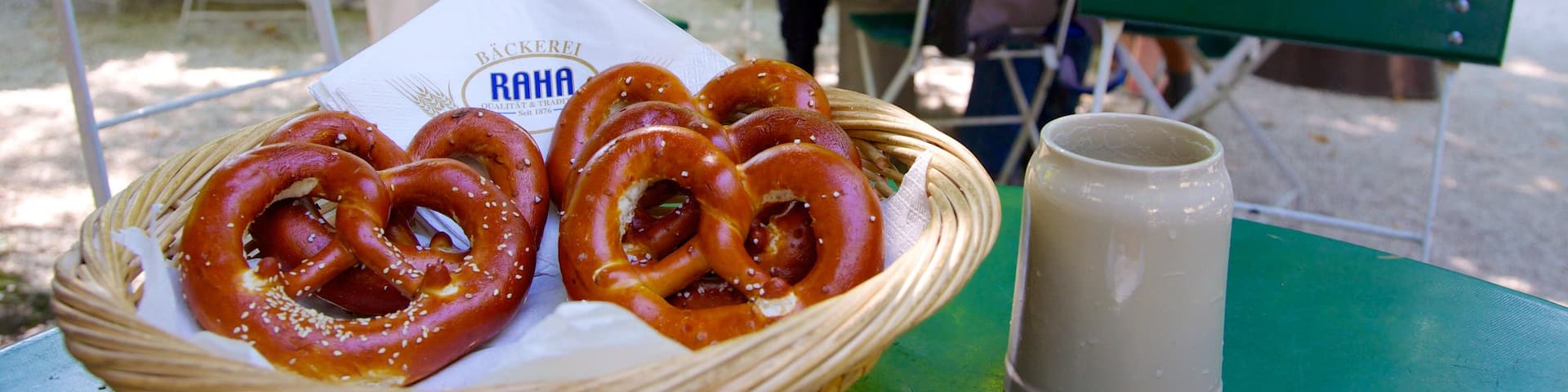 Augustiner Brewery featuring outdoor eating and food as well as a large group of people