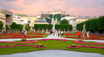 Mirabell Palace and Gardens showing a city, a castle and flowers