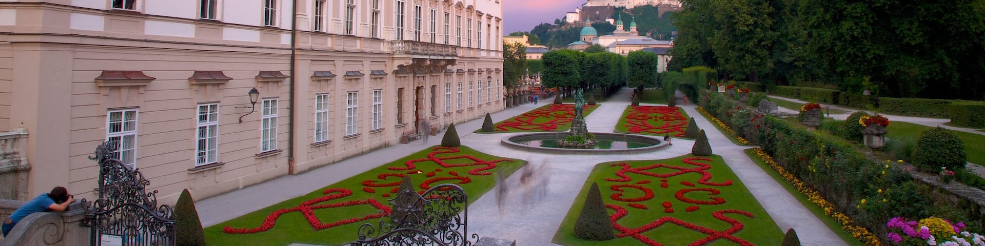 Mirabell Palace featuring chateau or palace, a sunset and heritage architecture