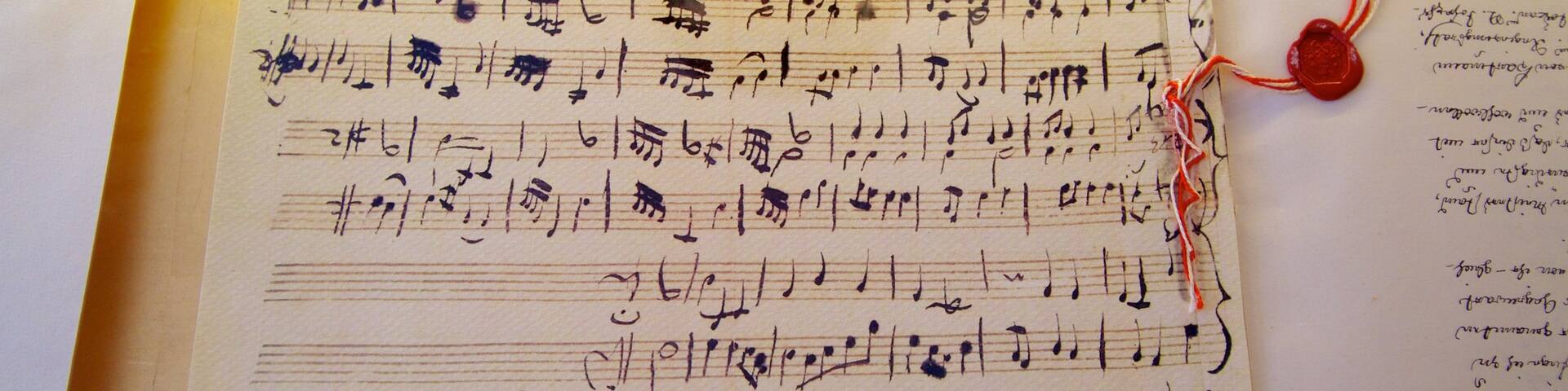 Mozart\'s Birthplace which includes signage and music