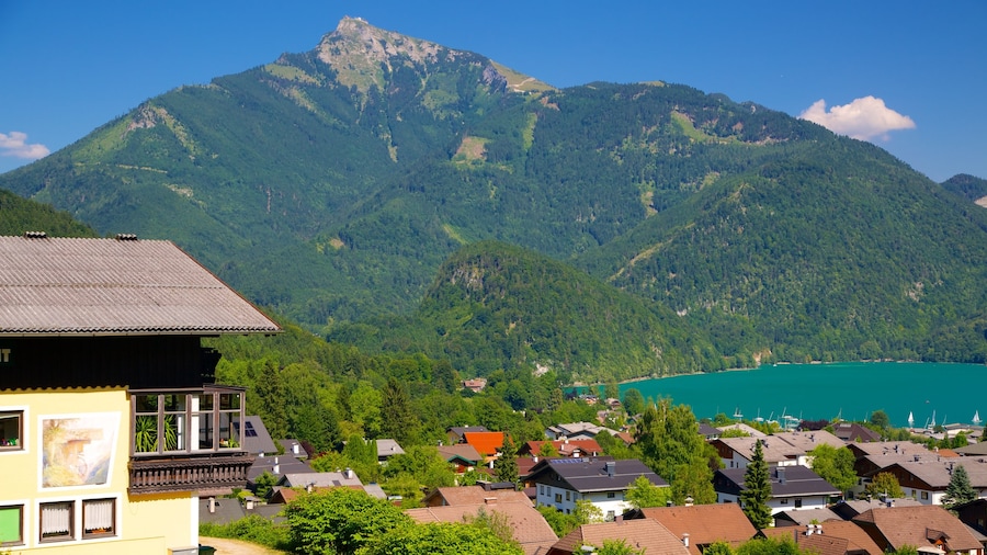 St. Gilgen showing a lake or waterhole, mountains and a small town or village