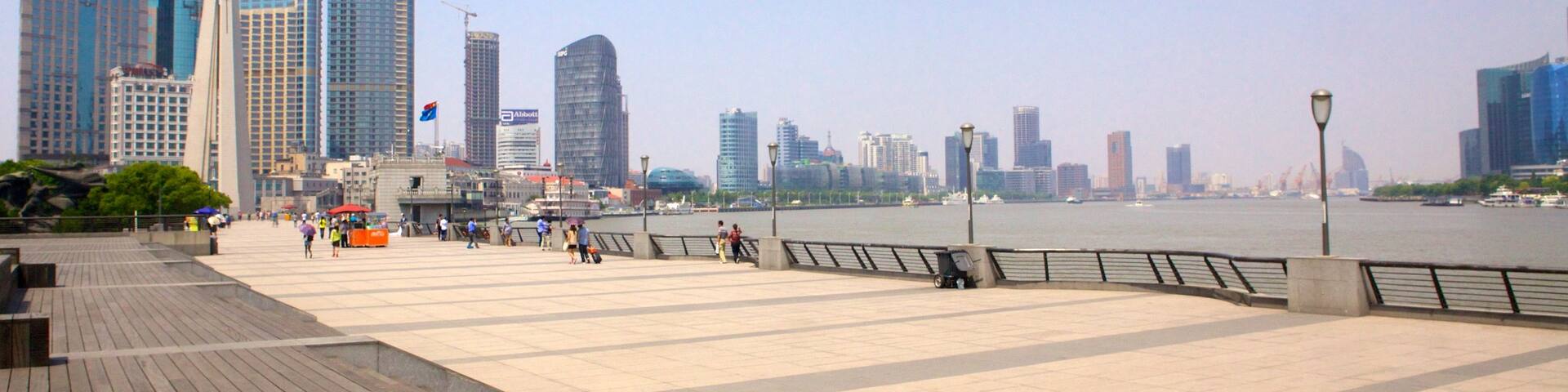 The Bund which includes modern architecture, landscape views and a skyscraper