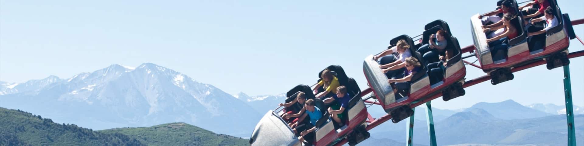 Glenwood Springs featuring landscape views and rides as well as a small group of people