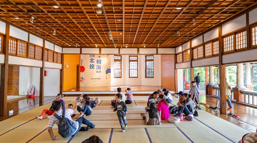 Beitou Hot Springs Museum featuring interior views and heritage elements as well as a small group of people