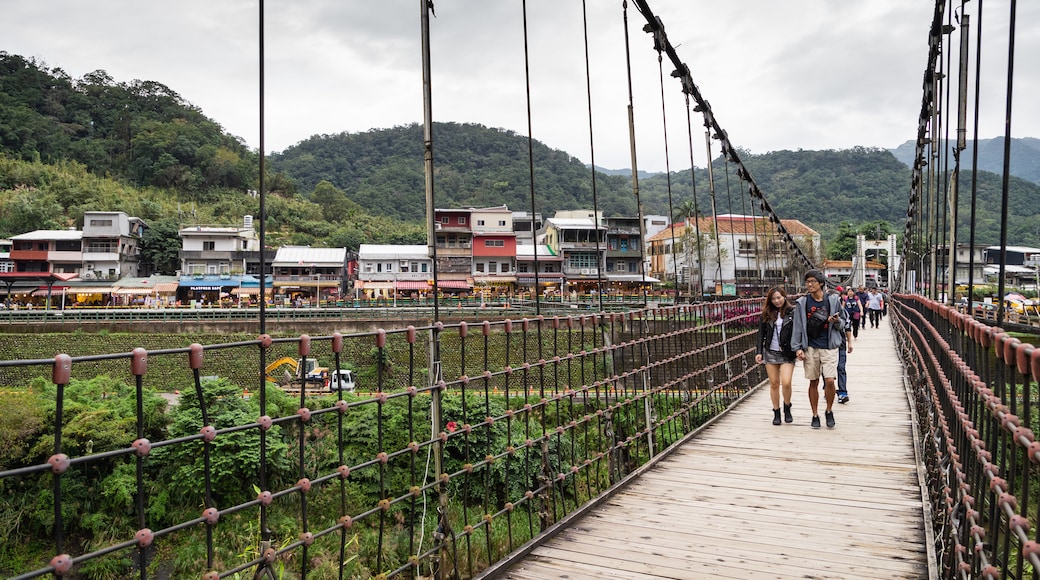 Shifen featuring a bridge, a small town or village and a river or creek