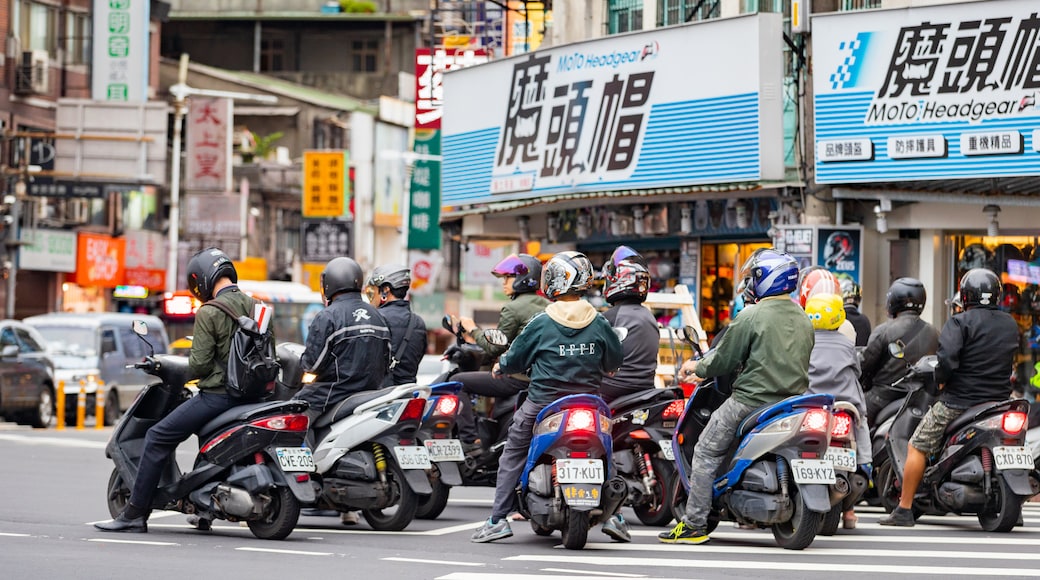 Banqiao featuring motorbike riding, a city and street scenes