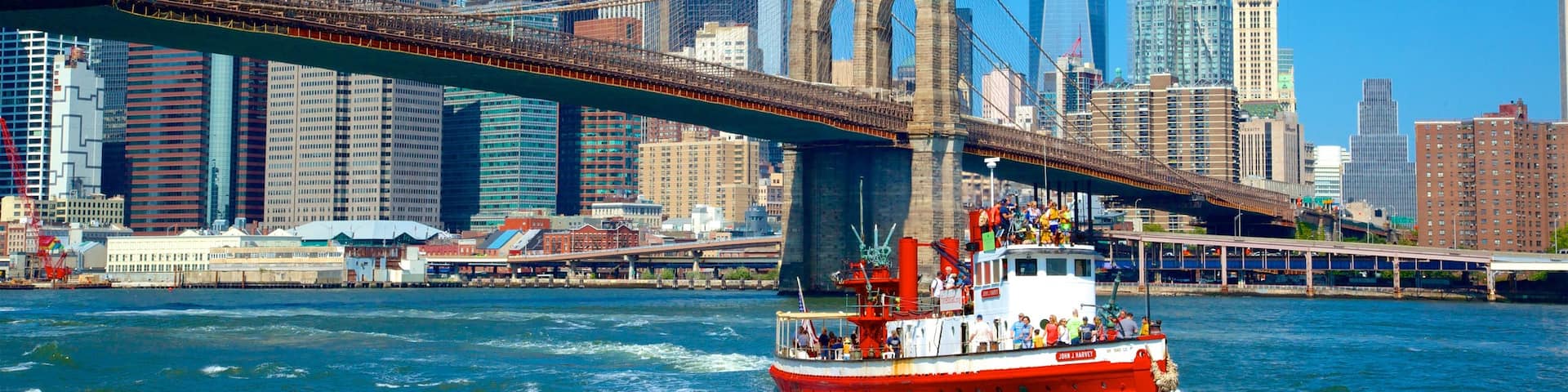New York showing boating, a bridge and a city