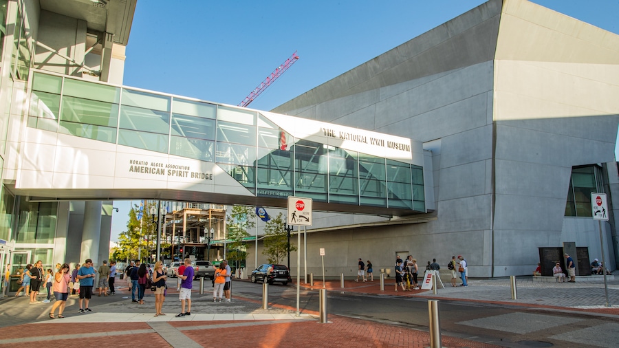 National World War II Museum which includes a city, street scenes and a bridge
