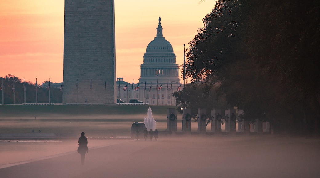 United States Capitol featuring a sunset, mist or fog and heritage architecture