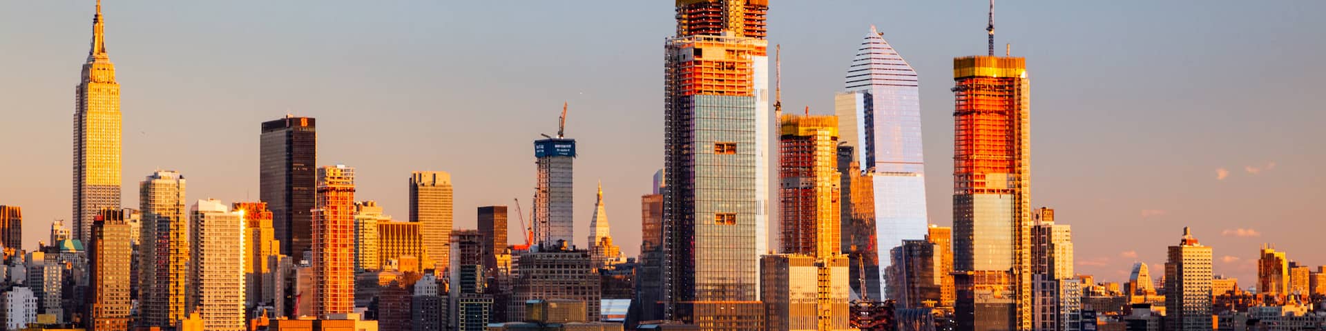 Midtown featuring a bay or harbor, a sunset and a city