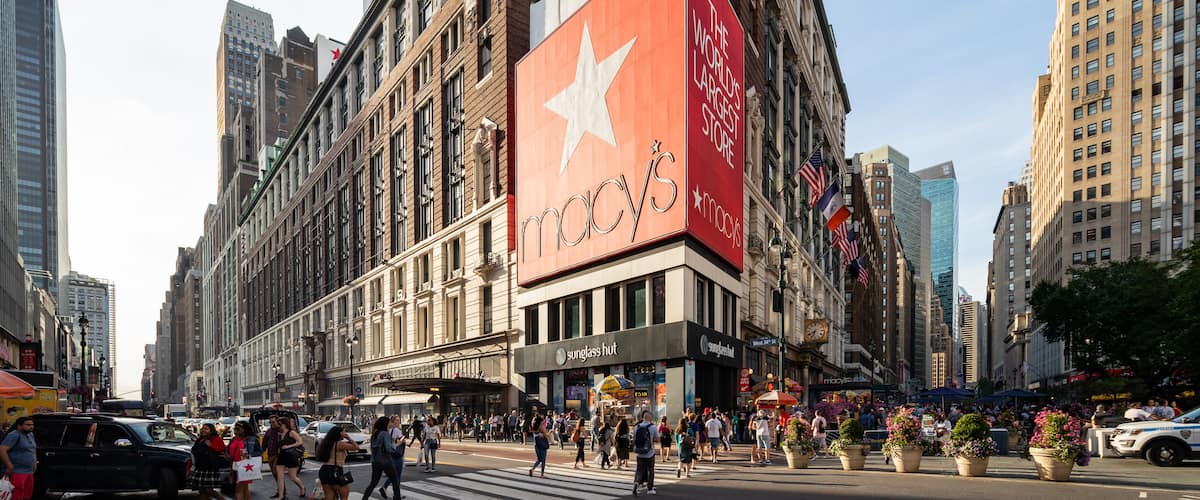 Macy\'s featuring signage, street scenes and a city
