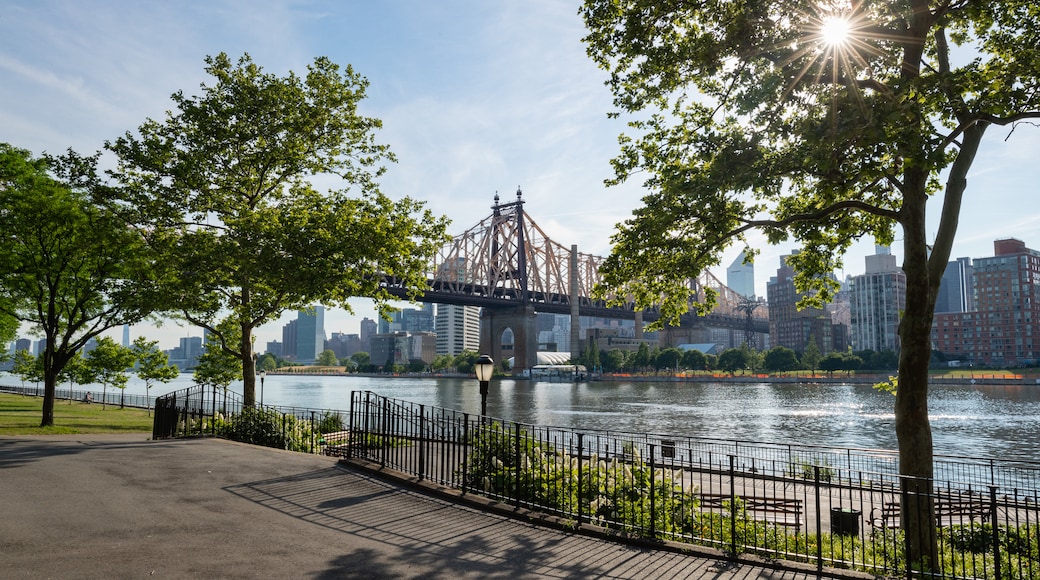 Queensbridge Park which includes a river or creek, a bridge and a sunset