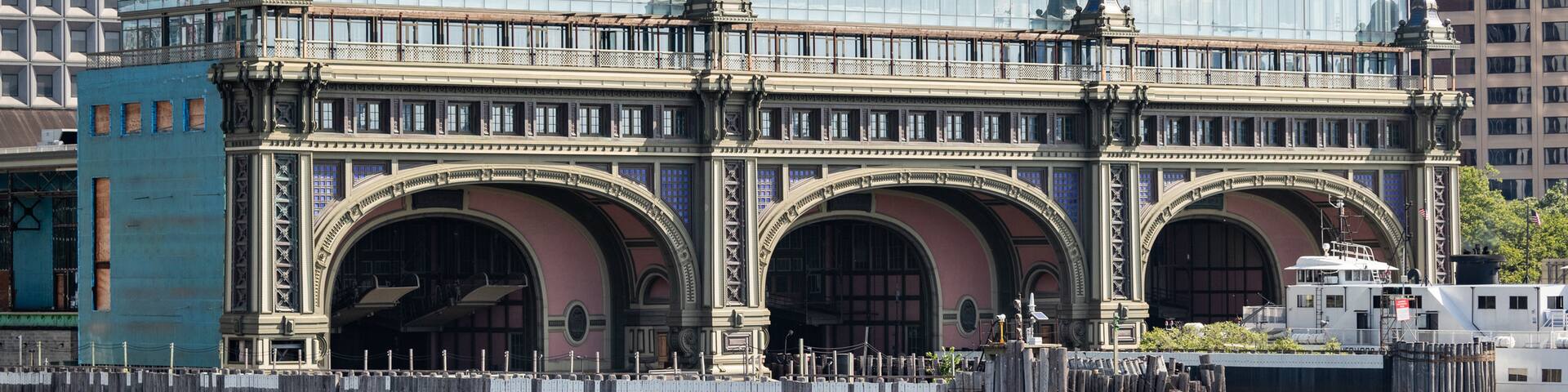 Staten Island Ferry Whitehall Terminal which includes heritage elements, a bay or harbor and a city