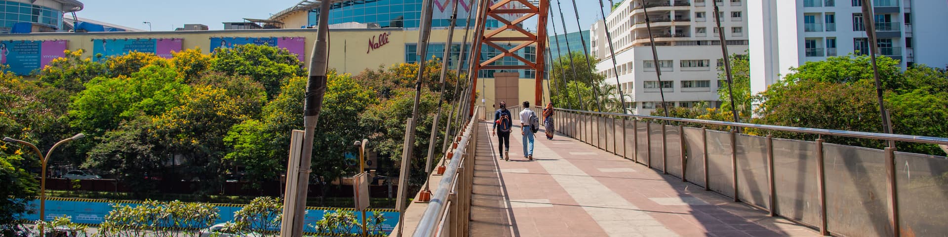 Thane showing a city and a bridge as well as a couple