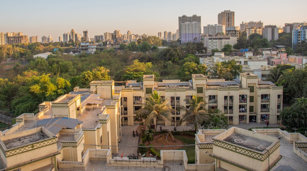 Thane featuring landscape views, a city and a sunset