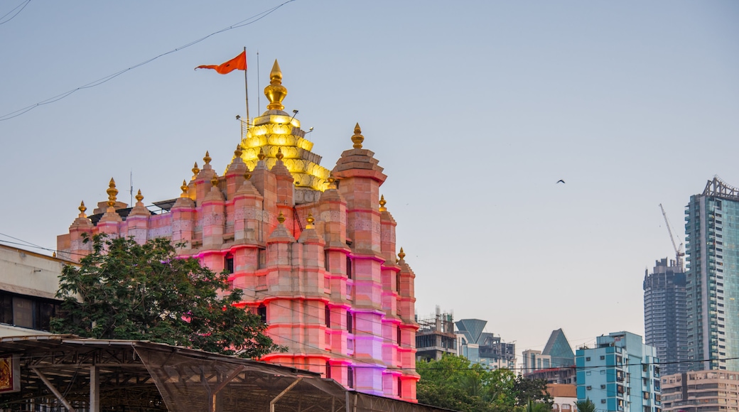 Siddhi Vinayak Temple which includes a sunset, heritage architecture and a city